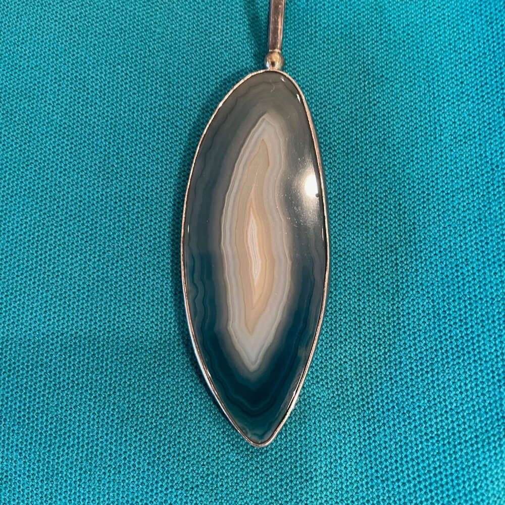 Obsidian drop framed in silver